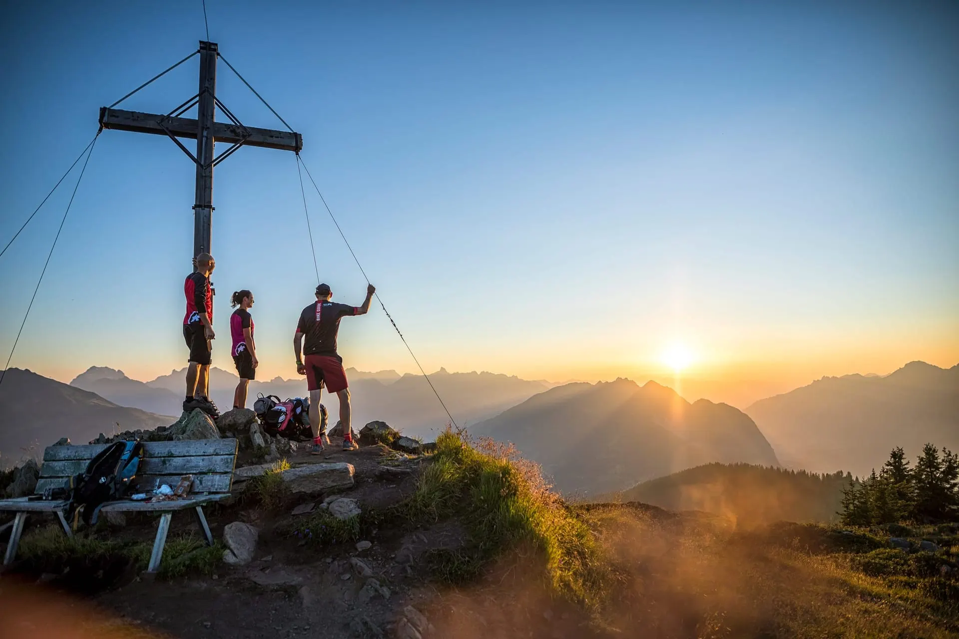 Summit cross on the Muttjöchle at sunset in the Montafon